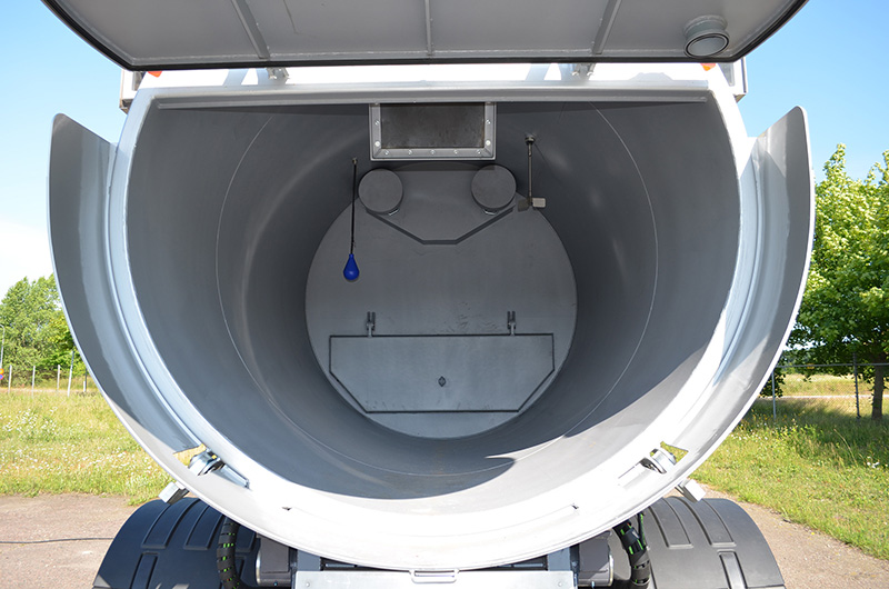 Close-up view inside the open cylindrical tank of a DISAB Vacturion™ DL10 unit, showing the internal partition and chamber structure used for safe, efficient collection and discharge of industrial materials.